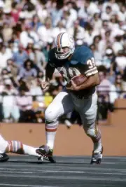 Running back Larry Csonka Miami Dolphins in action carries the ba- 1974 Photo