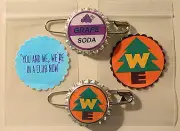 Set of 2 WE & ELLIE BADGE GRAPE SODA BOTTLECAP PINS! UP & 2 Sticker Gift Bags