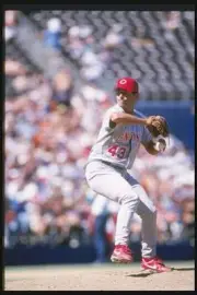 Cincinnati Reds pitcher Mike Remlngler throws a pitch at game agai- Old Photo