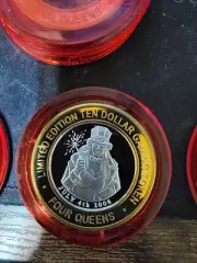 2006 FOUR QUEENS $10 RED Cap Silver Strike Lady with Sparkler .999