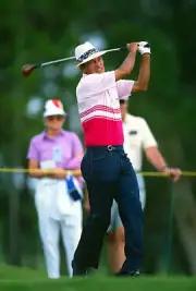 Golfer Juan Chi Chi Rodriguez swings and watches the flight of Golf 1988 Photo 4