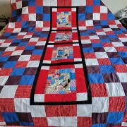 Handmade Raggedy Ann and Andy Quilt which measures approximately 87 by 71 inches