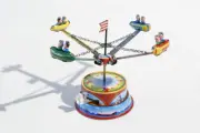 Small Rocket Carousel. Tin Toy / Retro / Clockwork Fairground Toy