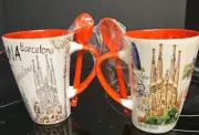 2 Cups From Barcelona Spain With Stirs Spoons