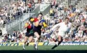 Howell Davies of the President's XV being chased by Clive Woodwar - Old Photo