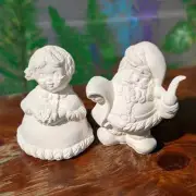 Winking Santa & Mrs. Santa Doc Holliday Bisque