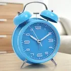 Compact Bell Clock with Loud Alarm and Illuminated Display for Night Use
