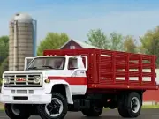 1/64 DCP WHITE/RED GMC 6500 SINGLE AXLE STAKE BED