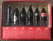 2002 Collectible Coca Cola Evolution Of The Contour Bottle 6 Mini Glass Bottles