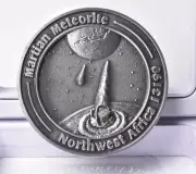 MARTIAN METEORITE INSIDE COLLECTORS COIN 0151, NORTH WEST AFRICA 13190 MT83