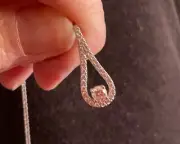 14k solid white gold teardrop pendant and silver chain. Both are 14k solid gold