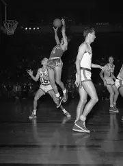 Boston Celtics Basketball Photo 1953 Bob Cousy Grabbing Ball Off Backboard