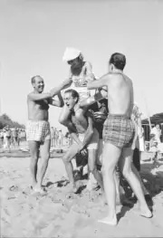 Man holding woman back beach during XVIII Venice International Fil- Old Photo 1