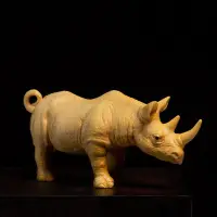 在飛比找Yahoo!奇摩拍賣優惠-小葉黃楊木雕客廳牛氣沖天實木動物辦公室雕刻工藝品犀牛文玩擺件