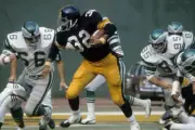 Running back Franco Harris Pittsburgh Steelers carries the ball v- 1974 Photo