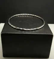 Twist bangle solid Sterling Silver, 3mm, Hallmark, 65mm internal diameter, New.