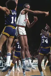 Kareem Abdul Jabbar Milwaukee Bucks battles for a jump ball with - 1974 Photo