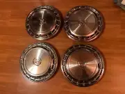 NOS set of 4 1987 1988 Cadillac DeVille Seville 14" Hubcaps Wheel Covers