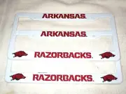 TWO (2) ARKANSAS RAZORBACKS EMBOSSED LICENSE PLATE FRAMES #010b SALE - NEW