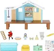 Bluey's Beach Cabin Playset, with Exclusive Bluey Figure with Goggles. Includes 10 Play Pieces and Sticker Sheet.