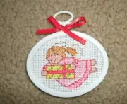 Finished completed cross stitch Angel with gift Christmas ornament