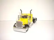 DCP FIRST GEAR 1/64 YELLOW WITH BLACK FENDERS PETERBILT 379 WITH 36" SLEEPER