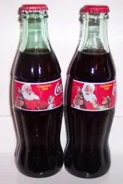 Coca-Cola 1999 Christmas Santa Claus Holiday Seasons Greetings 2 Coke Bottles