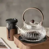 在飛比找樂天市場購物網優惠-耐高溫玻璃茶壺帶過濾木提梁加厚玻璃泡茶煮茶壺家用高硼玻璃壺