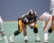 Offensive lineman Larry Brown Pittsburgh Steelers looks on from th- Old Photo