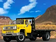 1/64 DCP YELLOW CHEVY C65 SINGLE AXLE FLATBED