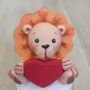 Edible 3D fondant/gum paste Lion holding Heart cake topper.