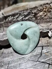Jadeite jade Mobius pendant high polish, carving. from Guate.