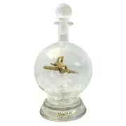 Ornamental glass model of a Spitfire aeroplane in a decorative glass decanter