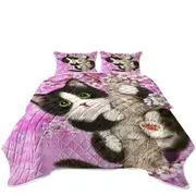 Cute Black and White Kitten Cat on Cherry Blossom Coverlet