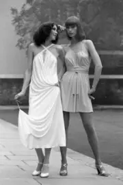 Cathee Wears A White Jersey Dress Beading Hilka Wears A 'Chinese C- 1975 Photo