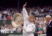 Steffi Graf of Germany lifts the trophy after defeating Martina N - Old Photo 1