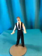 MINIATURE PORCELAIN MAN 1/2" SCALE DRESSED IN BLACK SLACKS AND WHITE SHIRT