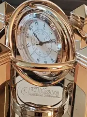 BENCHMARK The Silver Celestial Quartz Clock. Gyro-rotating. CISCO branded. NEW