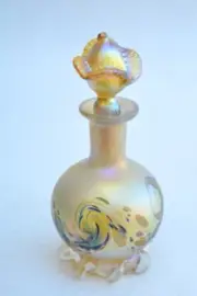 Gold Luster Perfume Bottle With Multicolor Wave Design. Saul Alcaraz