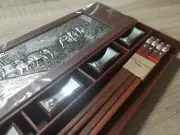 Four sets of rose wood chopsticks with metal elephant accents & rests
