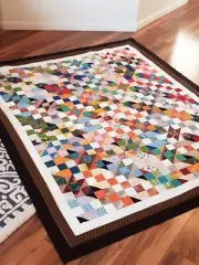 Handmade shattered glass quilt which measures approximately 70 by 59 inches and