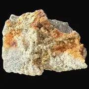 Sericite: colourless little cubes (1-2mm) of fluorite on cericite