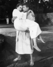 Frank Sinatra carries barefoot Grace Kelly after they take a dip i- Old Photo