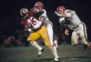 Washington Redskins Larry Brown in action tackle by Atlanta Falcon- Old Photo