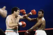 Gerry Cooney Throws A Punch Against Larry Holmes Old Boxing Photo