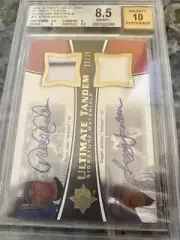 2006 ULTIMATE COLLECTION TANDEM SIGNATURE MATERIALS DEREK JETER REGGIE JACKSON