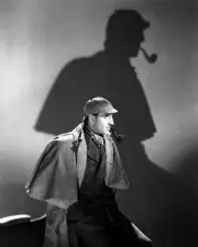 Basil Rathbone as Sherlock Holmes with shadow on wall behind him 24x30 Poster