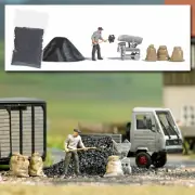Man weighing coal with a set of scales - HO/OO Gauge Busch 7928