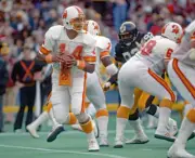 Quarterback Jack Thompson of the Tampa Bay Buccaneers looks to p- 1983 Old Photo