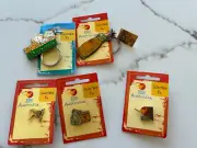 Collector Pins Cash’s Aminco Pins And Key Rings Brought At The Sydney Olympics